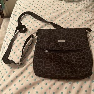 Black patterned baggalini purse with pink interior.